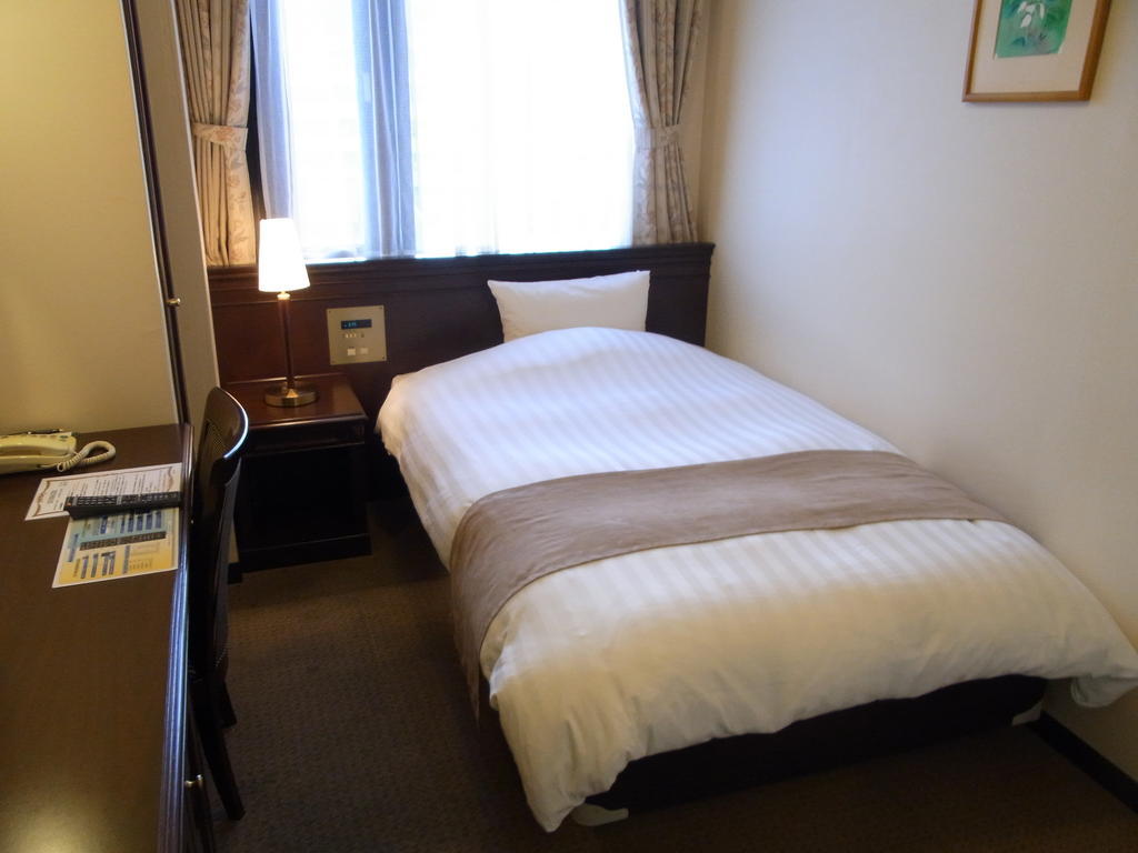 Amami Sunplaza Hotel Rum bild